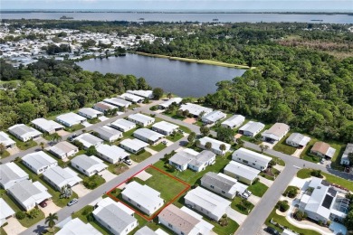 RARE OPPORTUNITY to own this gently used home on TWO LOTS on Barefoot Bay Golf Course in Florida - for sale on GolfHomes.com, golf home, golf lot