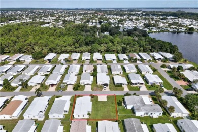 RARE OPPORTUNITY to own this gently used home on TWO LOTS on Barefoot Bay Golf Course in Florida - for sale on GolfHomes.com, golf home, golf lot