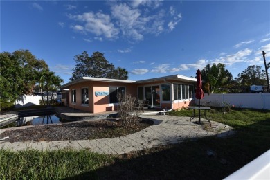 Gorgeous Dunedin pool home for sale. This house is located in on The Dunedin Country Club in Florida - for sale on GolfHomes.com, golf home, golf lot