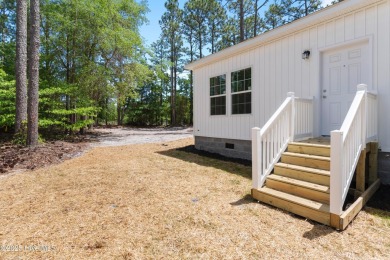 Modern, fresh, and move-in ready, this brand-new 3-bedroom on The Lakes Country Club in North Carolina - for sale on GolfHomes.com, golf home, golf lot