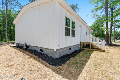 Modern, fresh, and move-in ready, this brand-new 3-bedroom on The Lakes Country Club in North Carolina - for sale on GolfHomes.com, golf home, golf lot