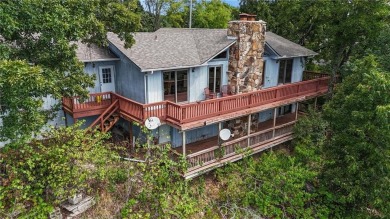 Breathtaking views of Lake Leatherwood and the Ozark Mountains on Holiday Island Executive Golf Course in Arkansas - for sale on GolfHomes.com, golf home, golf lot