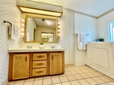 Panoramic view on the Golf Course and Pond! Gorgeous decorating on Indianwood Golf and Country Club in Florida - for sale on GolfHomes.com, golf home, golf lot