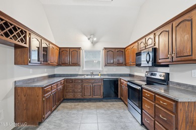 Welcome to 782 Fairway Trail, a beautifully refreshed 3-bedroom on Hernando Hills Country Club in Mississippi - for sale on GolfHomes.com, golf home, golf lot