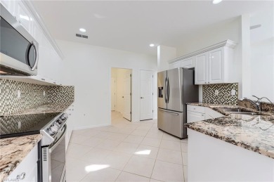 Newly painted and carpeted, this popular Kingfisher model is on Shadow Wood Country Club in Florida - for sale on GolfHomes.com, golf home, golf lot