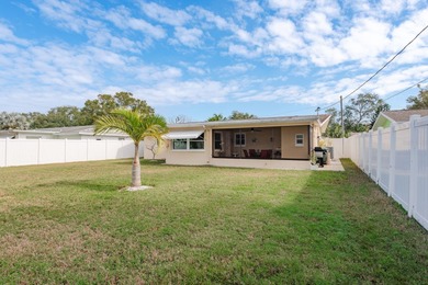 Under contract-accepting backup offers. This move-in ready home on The Dunedin Country Club in Florida - for sale on GolfHomes.com, golf home, golf lot