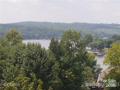 This premium Badin Lake water view lot is located in the on Old North State Club at Uwharrie Point Golf community in North Carolina - for sale on GolfHomes.com, golf home, golf lot