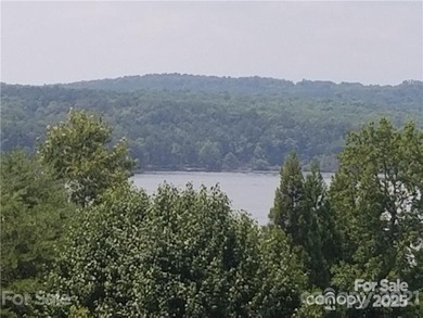 This premium Badin Lake water view lot is located in the on Old North State Club at Uwharrie Point Golf community in North Carolina - for sale on GolfHomes.com, golf home, golf lot