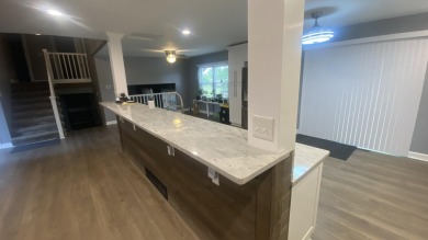 Beautifully Updated 4 bedroom 3 bath home located on large lot on Lakes of the Four Seasons Country Club in Indiana - for sale on GolfHomes.com, golf home, golf lot