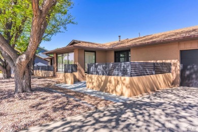 This Pueblo West beautiful brick home sits on the 7th fairway of on Desert Hawk At Pueblo West in Colorado - for sale on GolfHomes.com, golf home, golf lot