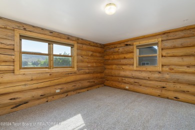 Nestled in the heart of Dubois, this authentic Swedish Cope log on Antelope Hills Golf Course in Wyoming - for sale on GolfHomes.com, golf home, golf lot