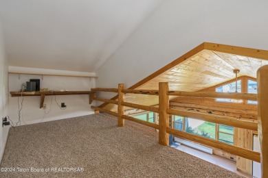 Nestled in the heart of Dubois, this authentic Swedish Cope log on Antelope Hills Golf Course in Wyoming - for sale on GolfHomes.com, golf home, golf lot