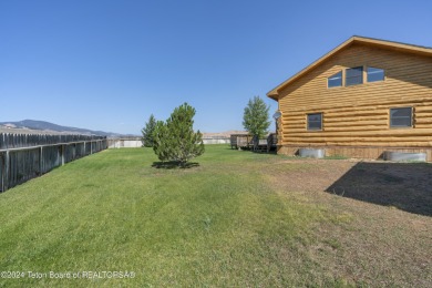 Nestled in the heart of Dubois, this authentic Swedish Cope log on Antelope Hills Golf Course in Wyoming - for sale on GolfHomes.com, golf home, golf lot