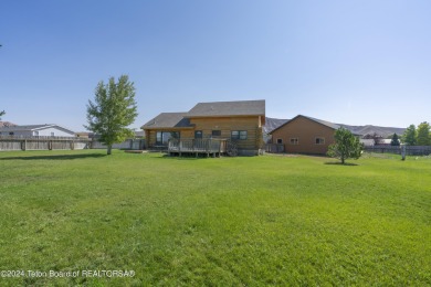 Nestled in the heart of Dubois, this authentic Swedish Cope log on Antelope Hills Golf Course in Wyoming - for sale on GolfHomes.com, golf home, golf lot