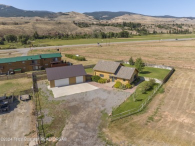 Nestled in the heart of Dubois, this authentic Swedish Cope log on Antelope Hills Golf Course in Wyoming - for sale on GolfHomes.com, golf home, golf lot