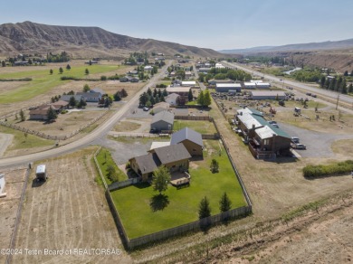 Nestled in the heart of Dubois, this authentic Swedish Cope log on Antelope Hills Golf Course in Wyoming - for sale on GolfHomes.com, golf home, golf lot