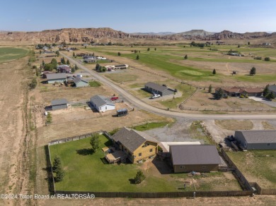 Nestled in the heart of Dubois, this authentic Swedish Cope log on Antelope Hills Golf Course in Wyoming - for sale on GolfHomes.com, golf home, golf lot