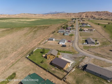 Nestled in the heart of Dubois, this authentic Swedish Cope log on Antelope Hills Golf Course in Wyoming - for sale on GolfHomes.com, golf home, golf lot