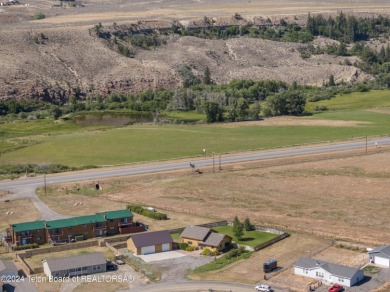 Nestled in the heart of Dubois, this authentic Swedish Cope log on Antelope Hills Golf Course in Wyoming - for sale on GolfHomes.com, golf home, golf lot