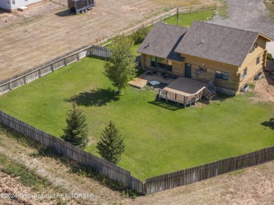 Nestled in the heart of Dubois, this authentic Swedish Cope log on Antelope Hills Golf Course in Wyoming - for sale on GolfHomes.com, golf home, golf lot