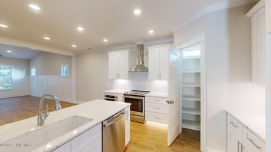 If you've been watching for the perfect coastal home, this on Brick Landing Plantation Yacht and Golf Club in North Carolina - for sale on GolfHomes.com, golf home, golf lot