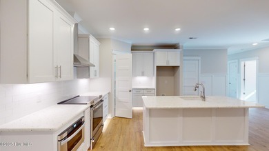 If you've been watching for the perfect coastal home, this on Brick Landing Plantation Yacht and Golf Club in North Carolina - for sale on GolfHomes.com, golf home, golf lot