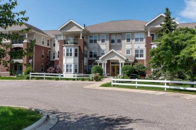 Perched on the top floor of the coveted Bella Casa, this on Pleasant View Golf Club in Wisconsin - for sale on GolfHomes.com, golf home, golf lot