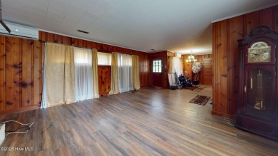 Enjoy quality time with loved ones in the spacious den, or host on Plymouth Country Club in North Carolina - for sale on GolfHomes.com, golf home, golf lot