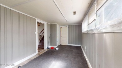 Enjoy quality time with loved ones in the spacious den, or host on Plymouth Country Club in North Carolina - for sale on GolfHomes.com, golf home, golf lot