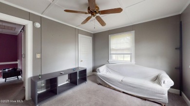 Enjoy quality time with loved ones in the spacious den, or host on Plymouth Country Club in North Carolina - for sale on GolfHomes.com, golf home, golf lot
