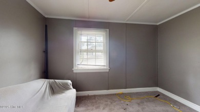 Enjoy quality time with loved ones in the spacious den, or host on Plymouth Country Club in North Carolina - for sale on GolfHomes.com, golf home, golf lot