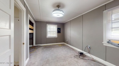Enjoy quality time with loved ones in the spacious den, or host on Plymouth Country Club in North Carolina - for sale on GolfHomes.com, golf home, golf lot
