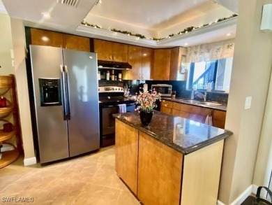 Inviting tropical oasis meets updated first floor convenience on The Landings Yacht, Golf and Tennis Club in Florida - for sale on GolfHomes.com, golf home, golf lot