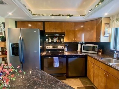 Inviting tropical oasis meets updated first floor convenience on The Landings Yacht, Golf and Tennis Club in Florida - for sale on GolfHomes.com, golf home, golf lot