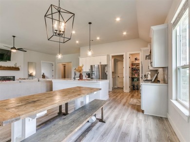 The neighborhood includes a pool, a golf course, a restaurant on Winter Creek Golf and Social Club in Oklahoma - for sale on GolfHomes.com, golf home, golf lot