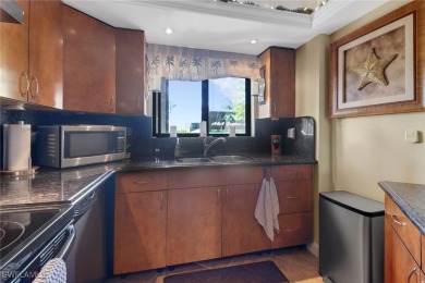 Inviting tropical oasis meets updated first floor convenience on The Landings Yacht, Golf and Tennis Club in Florida - for sale on GolfHomes.com, golf home, golf lot