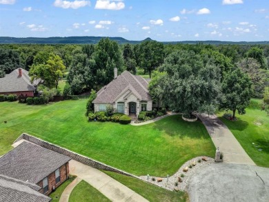 Welcome to 9705 Argyle Court -- a meticulously cared-for home on Pecan Plantation Country Club in Texas - for sale on GolfHomes.com, golf home, golf lot