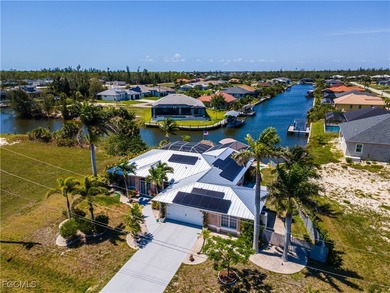 Discover Florida waterfront living at its finest in this on Burnt Store Golf Club in Florida - for sale on GolfHomes.com, golf home, golf lot