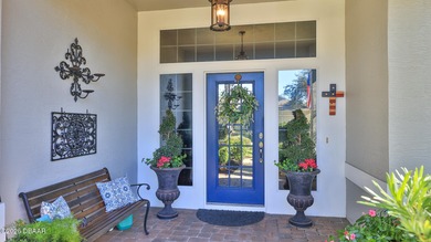 Warm and inviting 4 BR pool home with lake and fountain view on Plantation Bay Golf and Country Club in Florida - for sale on GolfHomes.com, golf home, golf lot