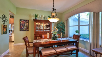 Warm and inviting 4 BR pool home with lake and fountain view on Plantation Bay Golf and Country Club in Florida - for sale on GolfHomes.com, golf home, golf lot