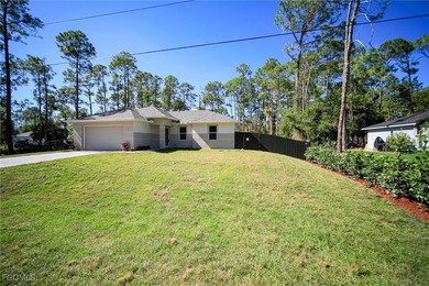 BRAND NEW CONSTRUCTION ON A 1/2 Acre Lot With A Fenced-In Back on Lehigh Resort Club in Florida - for sale on GolfHomes.com, golf home, golf lot