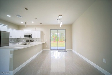 BRAND NEW CONSTRUCTION ON A 1/2 Acre Lot With A Fenced-In Back on Lehigh Resort Club in Florida - for sale on GolfHomes.com, golf home, golf lot