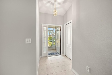 Under contract-accepting backup offers. A QUAINT MOVE-IN-READY on Tampa Bay Golf and Country Club in Florida - for sale on GolfHomes.com, golf home, golf lot