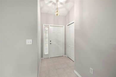 Under contract-accepting backup offers. A QUAINT MOVE-IN-READY on Tampa Bay Golf and Country Club in Florida - for sale on GolfHomes.com, golf home, golf lot