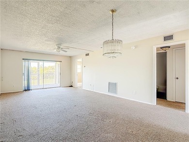 Prime second-floor 2-bedroom, 2-bath condo with in-residence on Royal Palm Golf Club in Florida - for sale on GolfHomes.com, golf home, golf lot