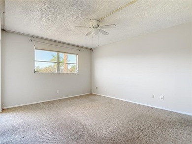 Prime second-floor 2-bedroom, 2-bath condo with in-residence on Royal Palm Golf Club in Florida - for sale on GolfHomes.com, golf home, golf lot