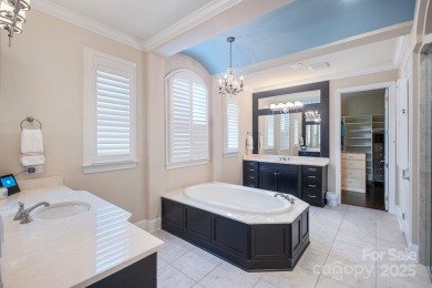 Situated on 1.64 acres w/golf course views, this home offers on Trump National Golf Club Charlotte in North Carolina - for sale on GolfHomes.com, golf home, golf lot