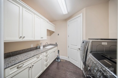 Situated on 1.64 acres w/golf course views, this home offers on Trump National Golf Club Charlotte in North Carolina - for sale on GolfHomes.com, golf home, golf lot