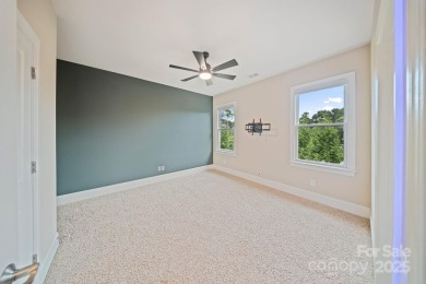 Situated on 1.64 acres w/golf course views, this home offers on Trump National Golf Club Charlotte in North Carolina - for sale on GolfHomes.com, golf home, golf lot