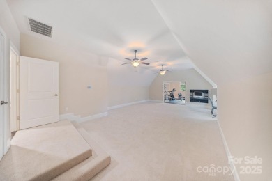 Situated on 1.64 acres w/golf course views, this home offers on Trump National Golf Club Charlotte in North Carolina - for sale on GolfHomes.com, golf home, golf lot
